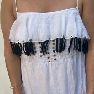 White cotton dress with tassles.